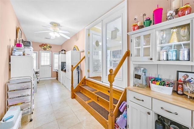 56 15th Ave, West Babylon, NY 11704 - staircase with tile patterned floors and a ceiling fan