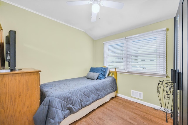 56 15th Ave, West Babylon, NY 11704 - bedroom with baseboards, wood finished floors, vaulted ceiling, and a ceiling fan