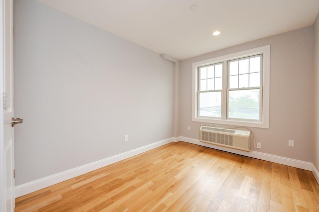 661 W Broadway Unit 204, Long Beach, NY 11561 - spare room featuring a wall mounted air conditioner, baseboards, light wood-style flooring, and recessed lighting