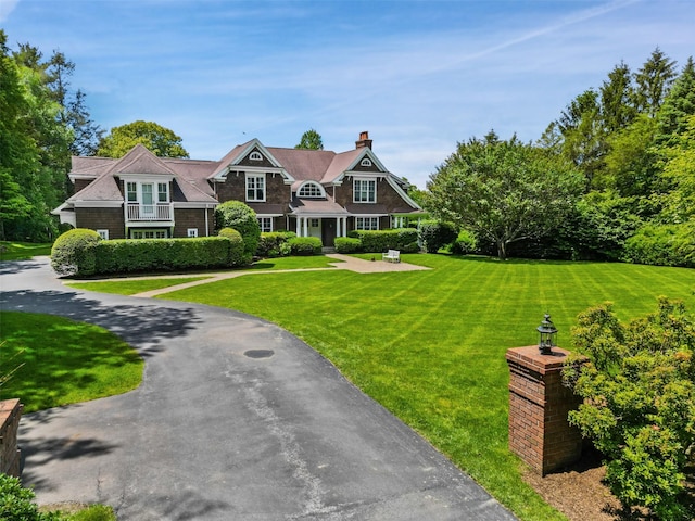 61 Carolyn Pl, Chappaqua, NY 10514 - shingle-style home featuring a chimney and a front lawn