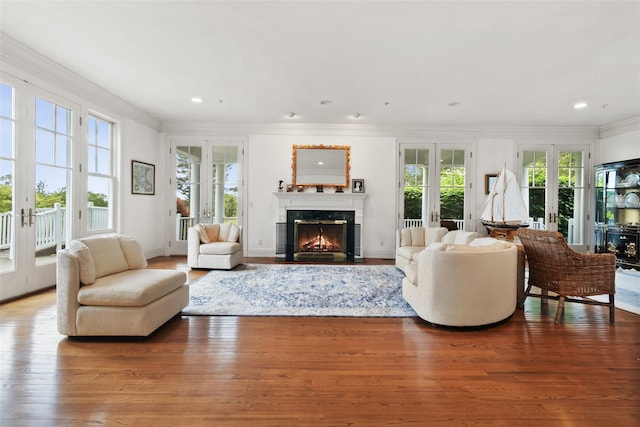61 Carolyn Pl, Chappaqua, NY 10514 - living room with french doors, crown molding, a fireplace, hardwood / wood-style floors, and recessed lighting