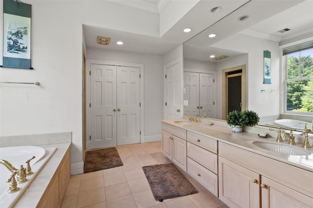 61 Carolyn Pl, Chappaqua, NY 10514 - bathroom with a closet, ornamental molding, a garden tub, double vanity, and recessed lighting
