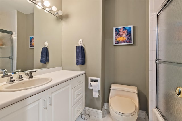 61 Carolyn Pl, Chappaqua, NY 10514 - bathroom featuring vanity, toilet, tile patterned floors, baseboards, and bath / shower combo with glass door