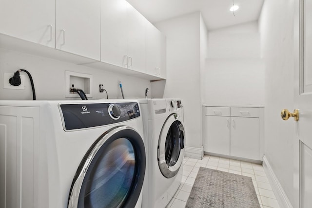 61 Carolyn Pl, Chappaqua, NY 10514 - laundry room featuring cabinet space, washing machine and clothes dryer, light tile patterned flooring, and baseboards
