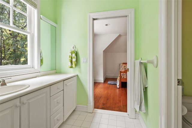 61 Carolyn Pl, Chappaqua, NY 10514 - bathroom with plenty of natural light, tile patterned flooring, baseboards, and double vanity