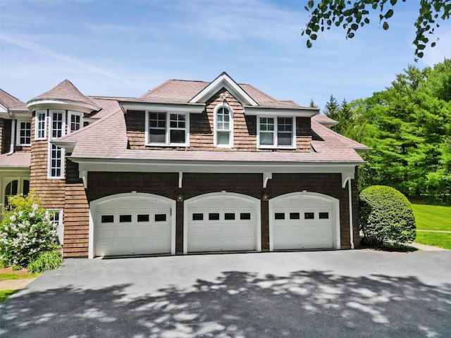 61 Carolyn Pl, Chappaqua, NY 10514 - view of front of house featuring driveway, an attached garage, and a shingled roof