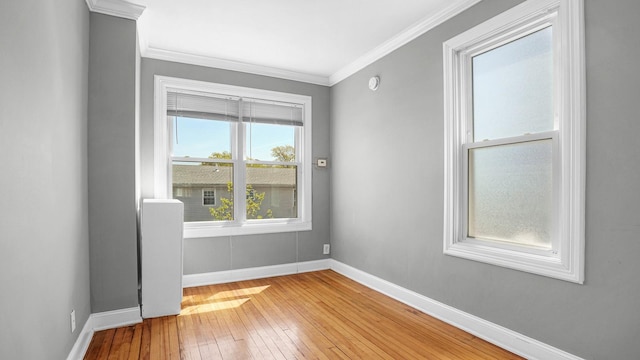 1528 Mayflower Ave, Bronx, NY 10461 - spare room with baseboards, light wood finished floors, and crown molding