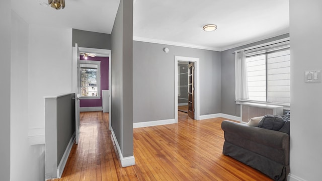 1528 Mayflower Ave, Bronx, NY 10461 - living area with light wood-style floors, baseboards, and crown molding
