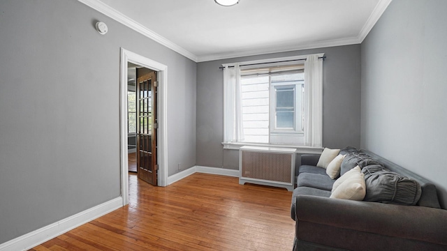 1528 Mayflower Ave, Bronx, NY 10461 - sitting room with radiator, hardwood / wood-style floors, baseboards, and crown molding