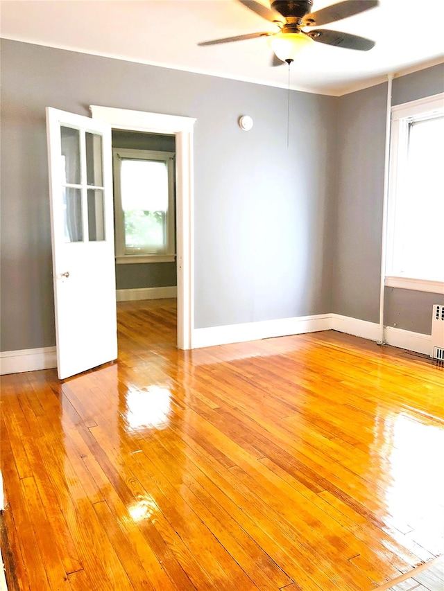 1528 Mayflower Ave, Bronx, NY 10461 - spare room featuring ceiling fan, light wood finished floors, radiator heating unit, and baseboards