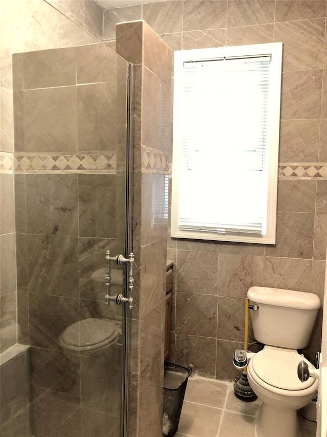 1528 Mayflower Ave, Bronx, NY 10461 - bathroom with a stall shower, toilet, and tile patterned flooring