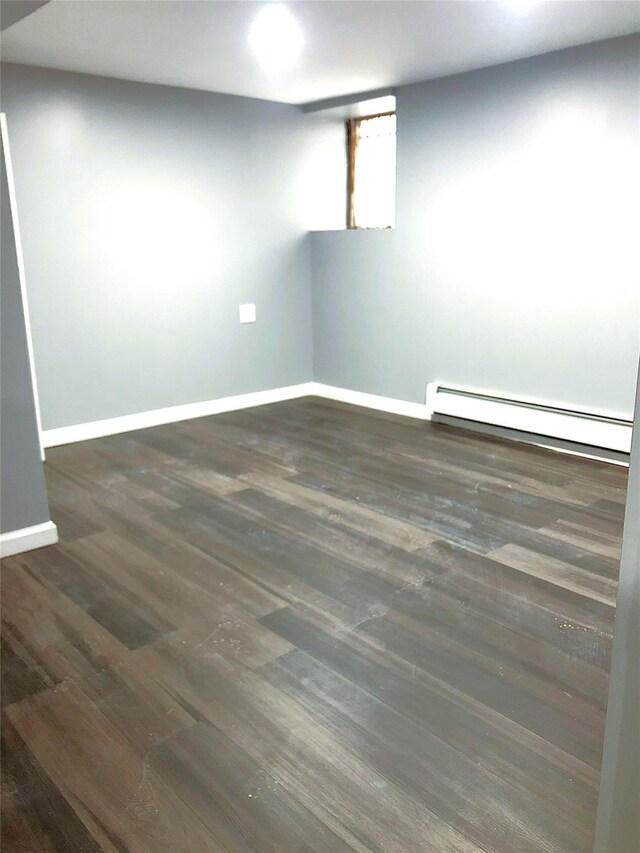 1528 Mayflower Ave, Bronx, NY 10461 - unfurnished room featuring a baseboard heating unit, baseboards, and wood finished floors