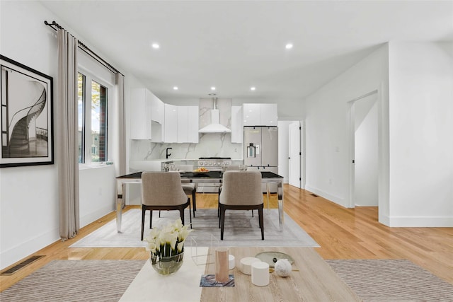 76-17 162nd St, Fresh Meadows, NY 11366 - dining room with baseboards, light wood finished floors, and recessed lighting