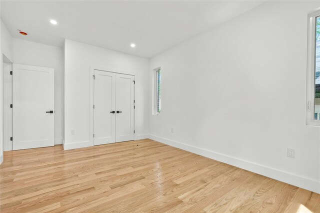 76-17 162nd St, Fresh Meadows, NY 11366 - unfurnished bedroom featuring light wood-type flooring, baseboards, and recessed lighting