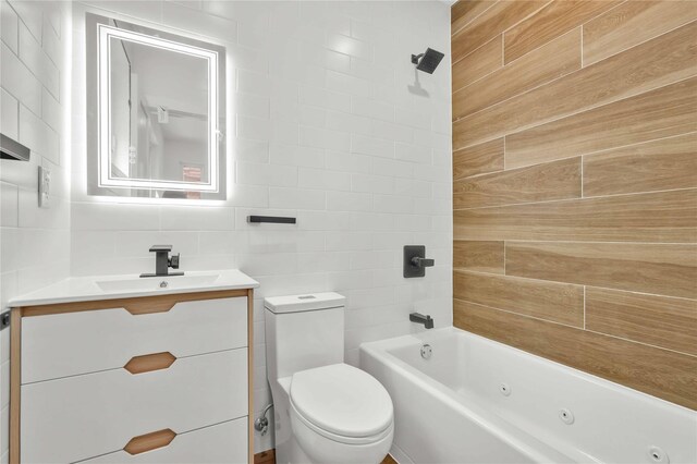 76-17 162nd St, Fresh Meadows, NY 11366 - bathroom with vanity, toilet, a combined bath / shower with jetted tub, and tile walls