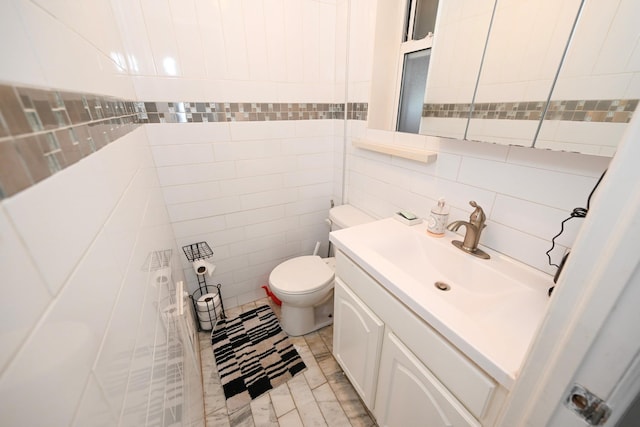 165 Page Rd, Valley Stream, NY 11581 - half bathroom featuring tile walls, vanity, and decorative backsplash