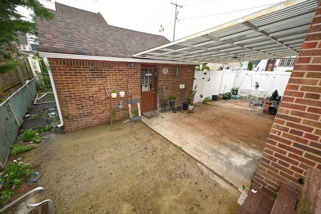 165 Page Rd, Valley Stream, NY 11581 - fenced backyard featuring a patio area