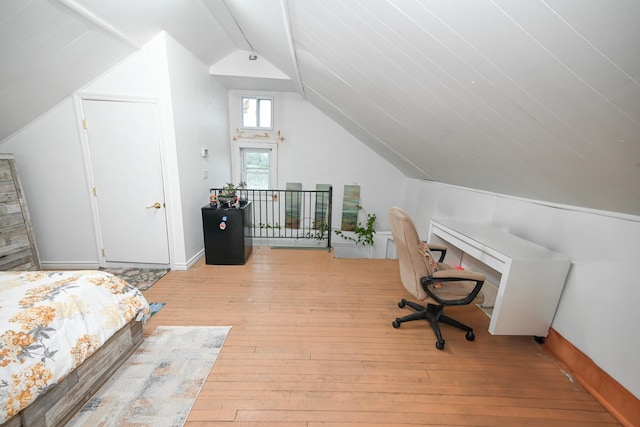 165 Page Rd, Valley Stream, NY 11581 - bedroom with lofted ceiling and light wood-style floors
