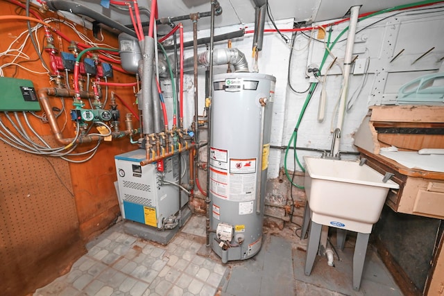 165 Page Rd, Valley Stream, NY 11581 - utility room featuring water heater, a heating unit, and a sink