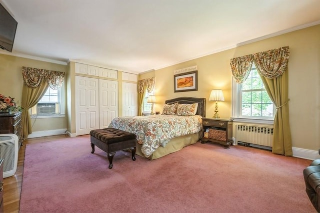 329 Brower Ave, Rockville Centre, NY 11570 - carpeted bedroom featuring radiator, multiple windows, crown molding, baseboards, and cooling unit