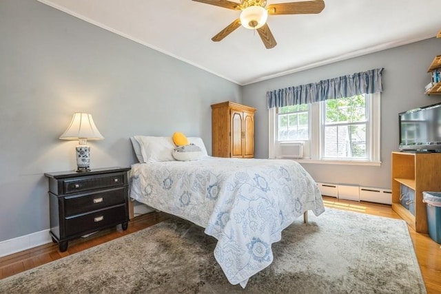 329 Brower Ave, Rockville Centre, NY 11570 - bedroom featuring wood finished floors, crown molding, vaulted ceiling, a baseboard radiator, and cooling unit