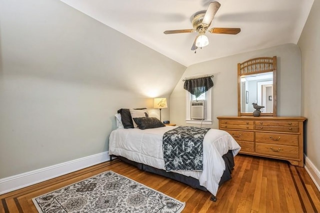 329 Brower Ave, Rockville Centre, NY 11570 - bedroom with baseboards, wood finished floors, lofted ceiling, ceiling fan, and cooling unit