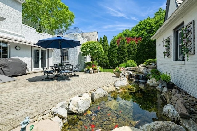 329 Brower Ave, Rockville Centre, NY 11570 - view of patio / terrace with a grill and outdoor dining area