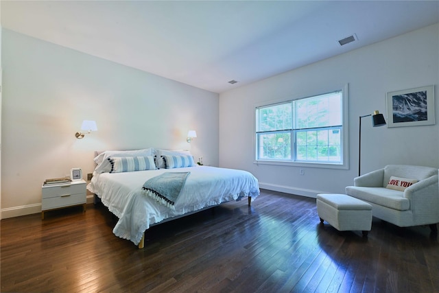 124 Pond View Dr Unit 317, Port Washington, NY 11050 - bedroom with baseboards and dark wood-style flooring