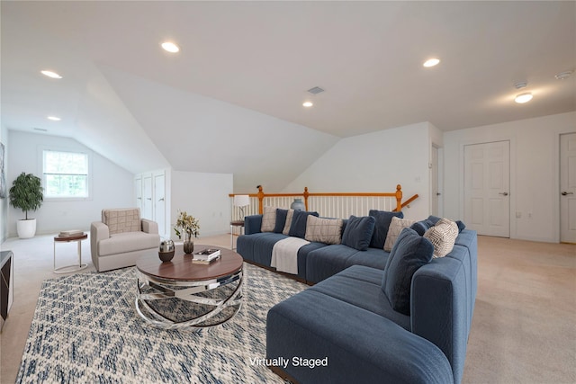 124 Pond View Dr Unit 317, Port Washington, NY 11050 - living area featuring light colored carpet, vaulted ceiling, and recessed lighting