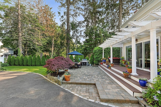38 Maple Ave, Northport, NY 11768 - view of patio featuring a pergola and outdoor dining space
