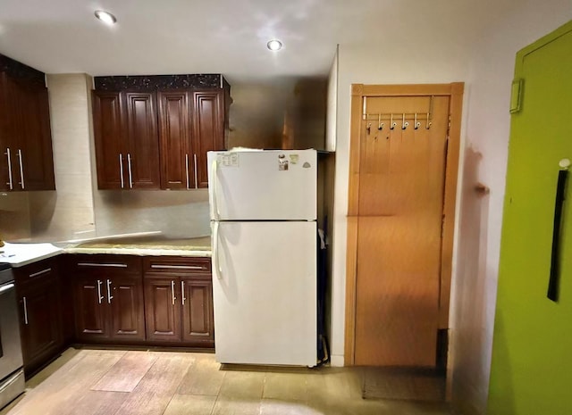 138-70 Elder Ave Unit 3C, Flushing, NY 11355 - kitchen featuring freestanding refrigerator, dark brown cabinets, and recessed lighting