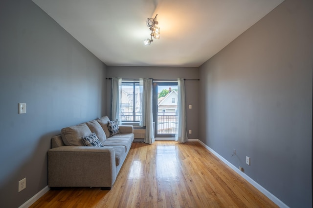 17524 89th Ave Unit C, Jamaica, NY 11432 - living area with light wood-type flooring and baseboards