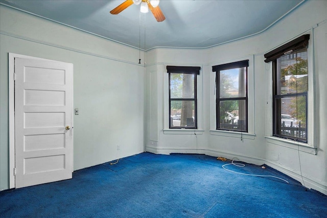 243 E 234th St, Bronx, NY 10470 - empty room featuring dark colored carpet and ceiling fan