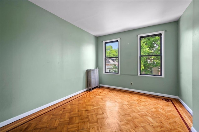 243 E 234th St, Bronx, NY 10470 - unfurnished room featuring radiator heating unit and baseboards