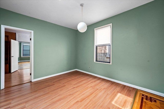 243 E 234th St, Bronx, NY 10470 - unfurnished room with wood finished floors and baseboards