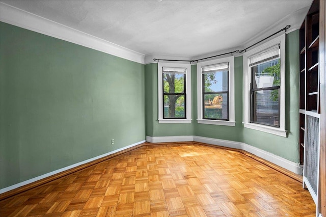 243 E 234th St, Bronx, NY 10470 - spare room with plenty of natural light, baseboards, and crown molding