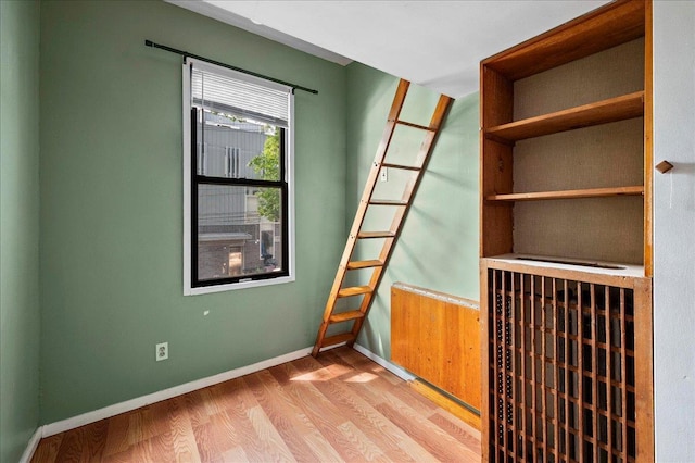 243 E 234th St, Bronx, NY 10470 - unfurnished room featuring wood finished floors and baseboards