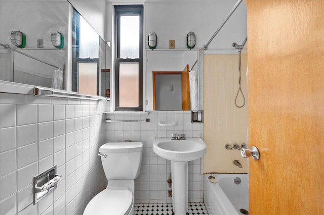 243 E 234th St, Bronx, NY 10470 - bathroom with toilet, shower / bath combination, and tile walls