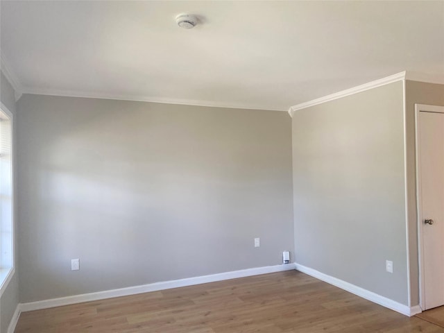 122 Oak Park Ter, Wappingers Falls, NY 12590 - empty room with ornamental molding, light wood-type flooring, baseboards, and a smoke detector