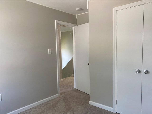 122 Oak Park Ter, Wappingers Falls, NY 12590 - unfurnished bedroom with carpet floors, baseboards, and a closet