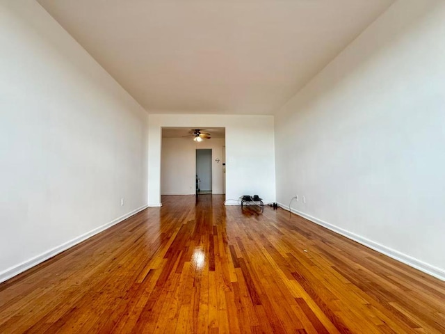 38-15 149th St Unit 6S, Flushing, NY 11354 - empty room featuring wood finished floors, baseboards, and a ceiling fan