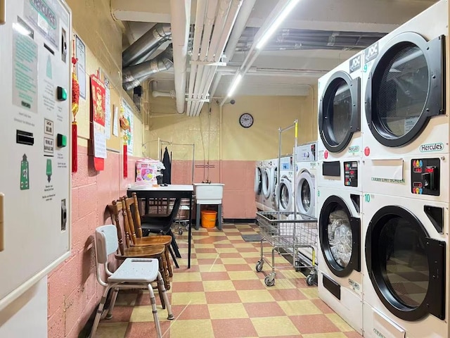 38-15 149th St Unit 6S, Flushing, NY 11354 - community laundry room featuring tile patterned floors, stacked washer and clothes dryer, and washing machine and clothes dryer