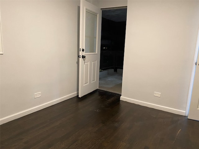 138-70 Elder Ave Unit 7H, Flushing, NY 11355 - spare room featuring baseboards and dark wood-type flooring