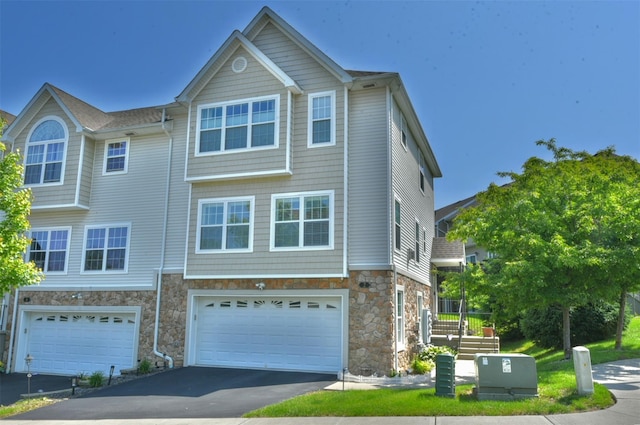 2 Hidden Creek Blvd, Monroe, NY 10950 - multi unit property with stone siding, an attached garage, and driveway