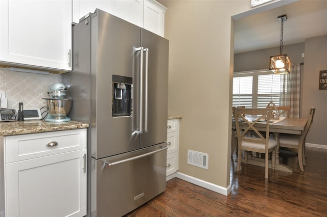 2 Hidden Creek Blvd, Monroe, NY 10950 - kitchen with high quality fridge, baseboards, dark wood-style flooring, tasteful backsplash, and white cabinets