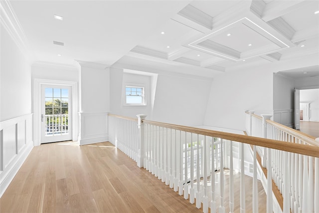 44 Club Ln, Remsenburg, NY 11960 - hallway featuring an upstairs landing, wood finished floors, beamed ceiling, ornamental molding, and a decorative wall