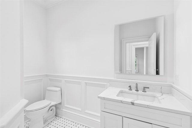 44 Club Ln, Remsenburg, NY 11960 - half bath with toilet, vanity, wainscoting, and ornamental molding