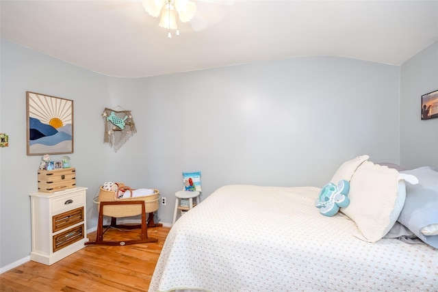 58 Hooper St, Port Jefferson Station, NY 11776 - bedroom featuring light wood-style flooring, baseboards, vaulted ceiling, and a ceiling fan