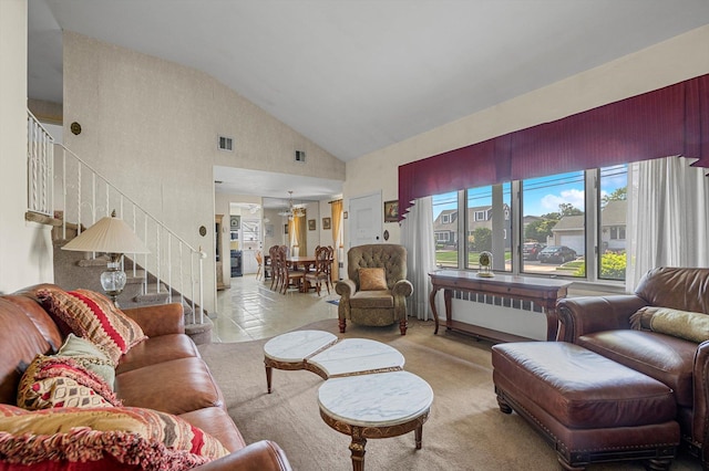 116 Intervale Ave, Farmingdale, NY 11735 - living room with radiator heating unit, stairs, and high vaulted ceiling