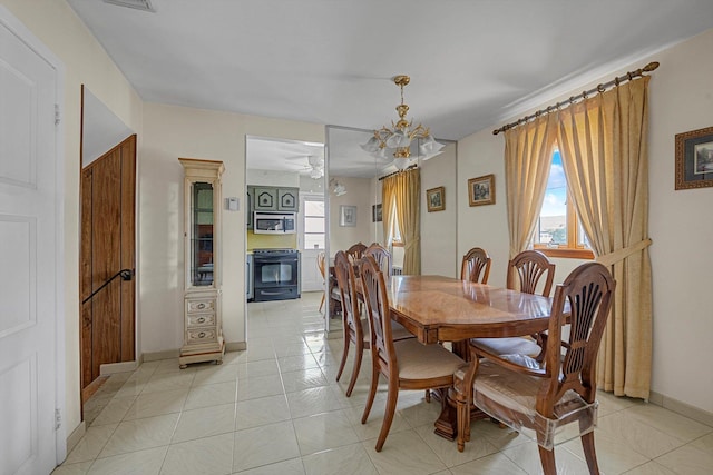 116 Intervale Ave, Farmingdale, NY 11735 - dining room with baseboards and a chandelier